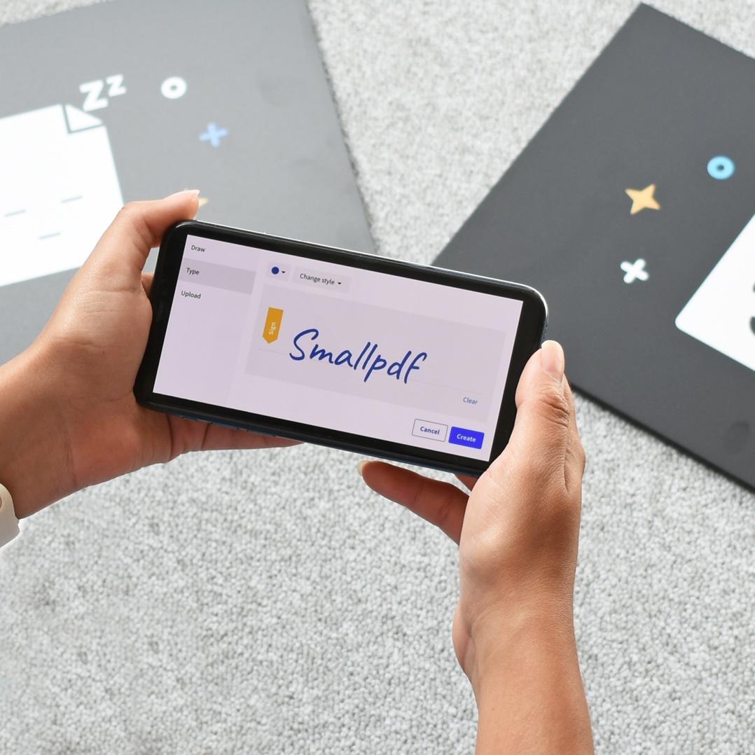 A20person20holding20a20tablet0A0ADescription20automatically20generated20with20low20confidence 1